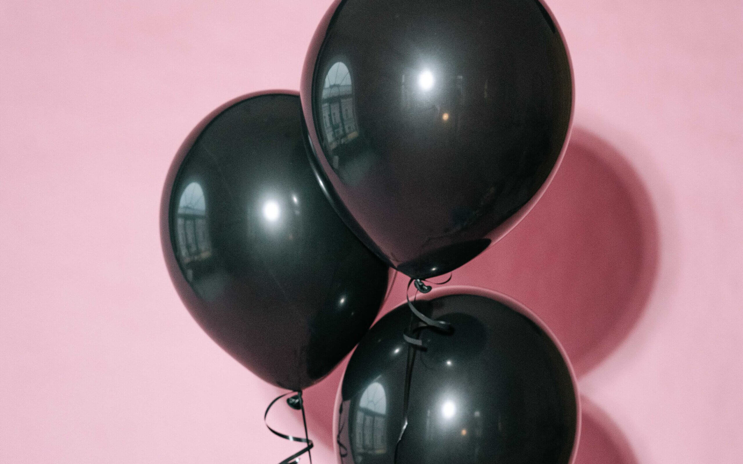 Three black balloons